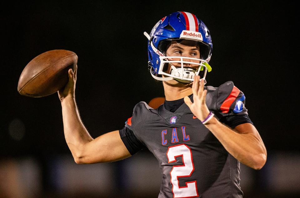 CAL quarterback Cole Hodge (2) warms up before the Christian Academy Centurions faced off against the Central Yellowjackets in the third round of the KHSAA football playoffs on Friday night. Nov. 17, 2023.