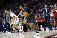 Oklahoma guard Grant Sherfield (25) brings the ball up the court during the first half of an NCAA college basketball game against Alabama, Saturday, Jan. 28, 2023, in Norman, Okla. (AP Photo/Garett Fisbeck)