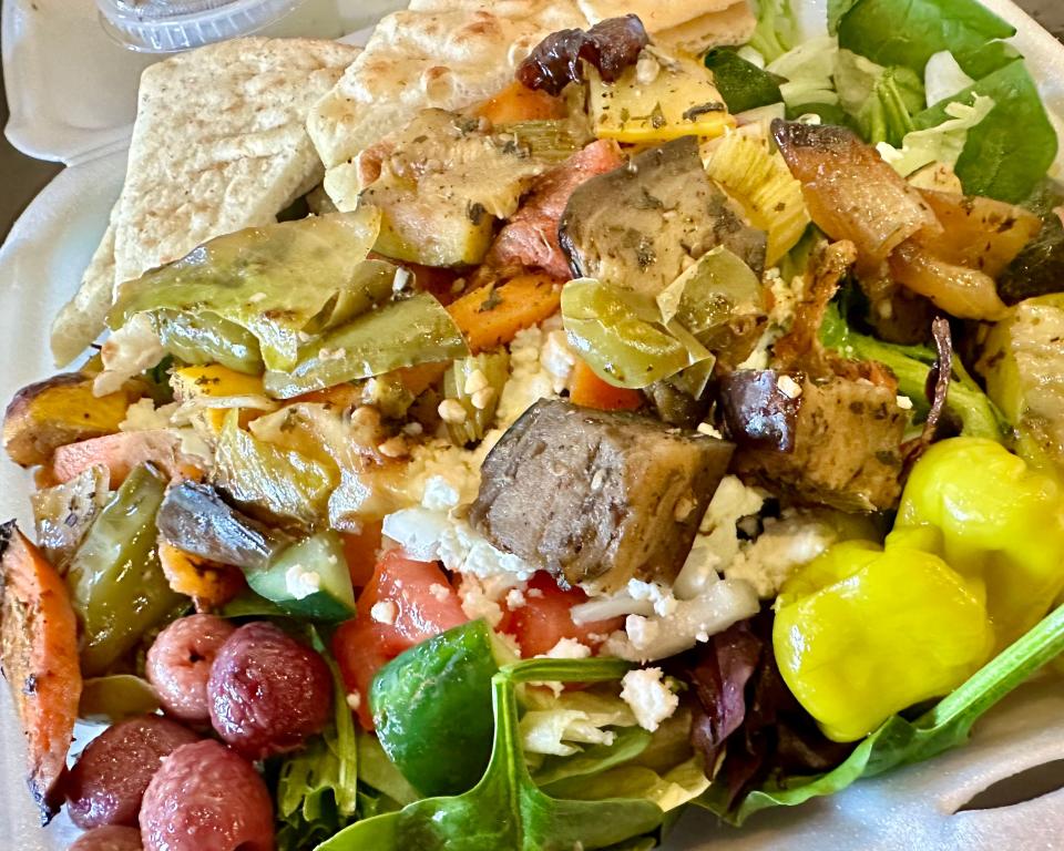 A generously sized Grecian salad with the addition of roasted mixed vegetables is a meal in itself.