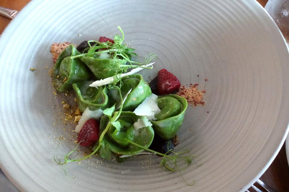 Green tortellini with Bellwether ricotta, pickled strawberry, pistachio, pecorino and saba at Fat Ox in Scottsdale.