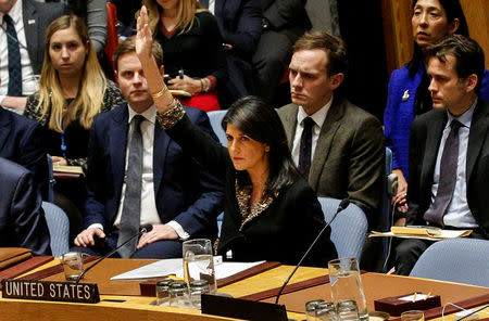 U.S. Ambassador to the United Nations Nikki Haley vetos an Egyptian-drafted resolution regarding recent decisions concerning the status of Jerusalem, during the United Nations Security Council meeting on the situation in the Middle East, including Palestine, at U.N. Headquarters in New York City, New York, U.S., December 18, 2017. REUTERS/Brendan McDermid