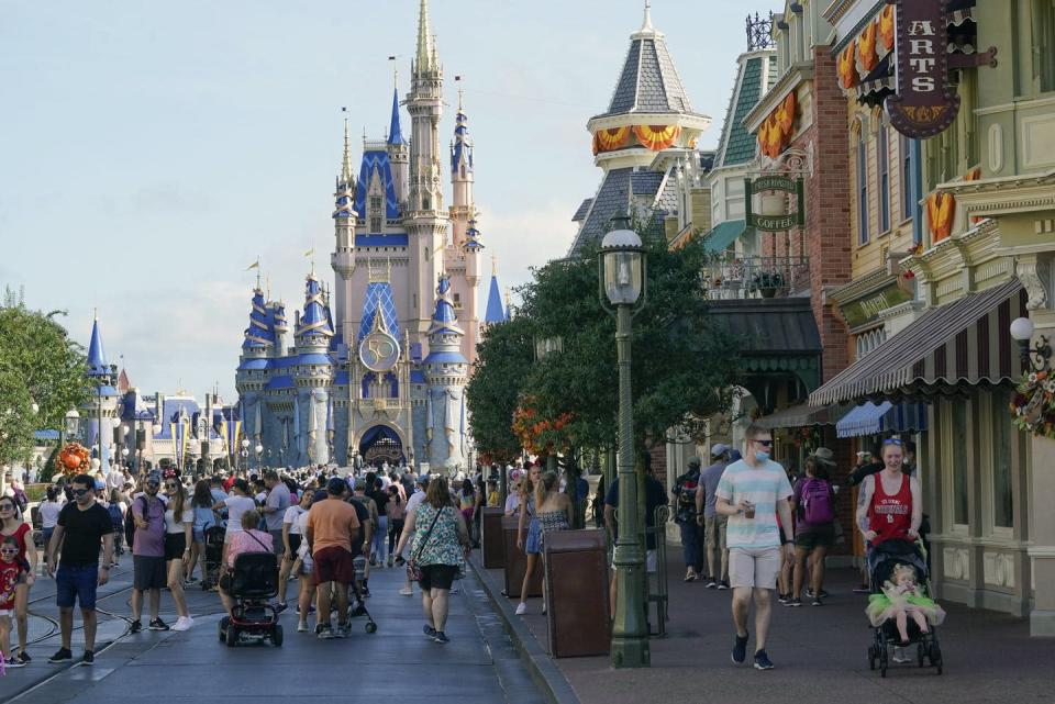 <span class="caption">Many critique Disney adults as being victims of exploitation because Disney merchandise and trips to the parks come at a steep price.</span> <span class="attribution"><span class="source">(AP Photo/John Raoux)</span></span>