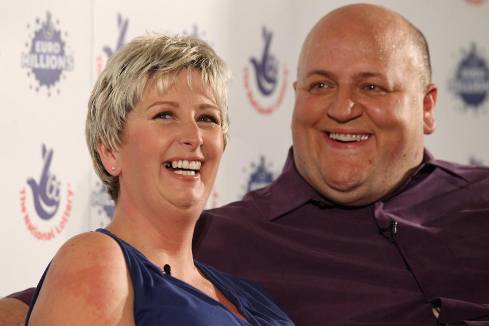 HATFIELD HEATH, ENGLAND - AUGUST 14: Adrian and Gillian Bayford celebrate winning the jackpot of over 148 million GBP in the EuroMillions lottery on August 14, 2012 in Hatfield Heath, England. The couple from Haverhill, Suffolk were the only winners of the Europe-wide lottery whose jackpot had rolled-over 14 times before being won by Mr and Mrs Bayford. (Photo by Oli Scarff/Getty Images)