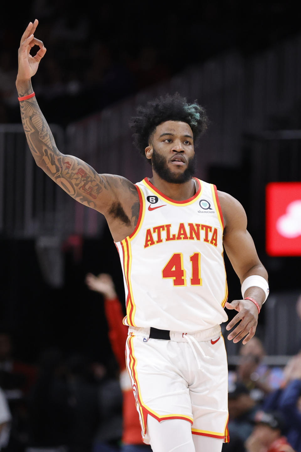 Atlanta Hawks forward Saddiq Bey celebrates a 3-point basket during the first half of the team's NBA basketball game against the Detroit Pistons on Tuesday, March 21, 2023, in Atlanta. (AP Photo/Alex Slitz)