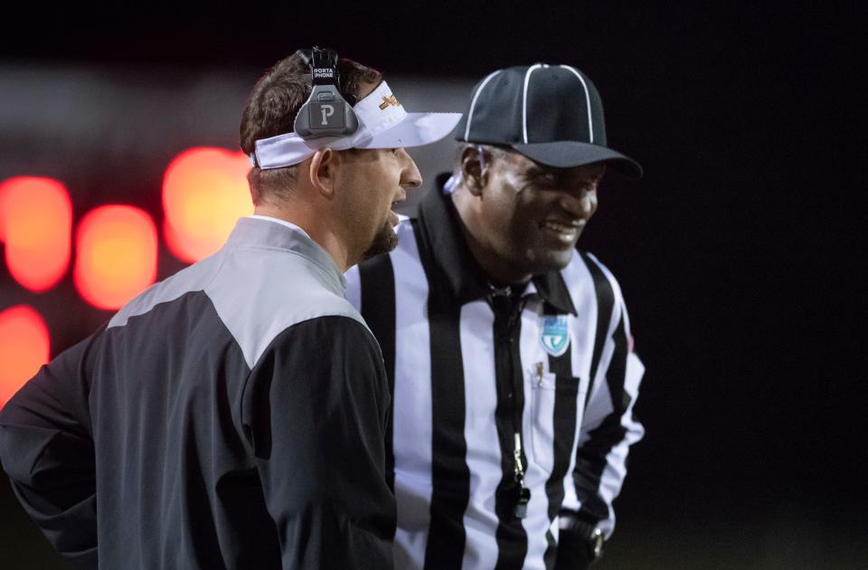 Chiefs head coach Wesley Summerford talks with a referee during the Bozeman vs Northview playoff football game at Northview High School on Friday, Nov. 12, 2021