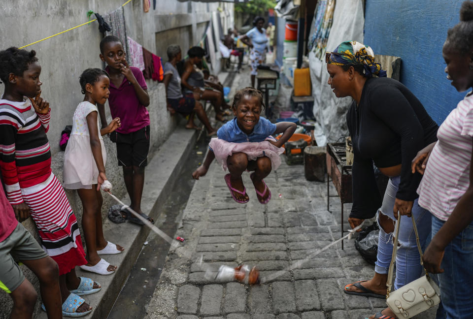 FILE - A girl plays a jump rope game at a school housing residents displaced by gang violence in Port-au-Prince, Haiti, Wednesday, May 15, 2024. (AP Photo/Ramon Espinosa, File)