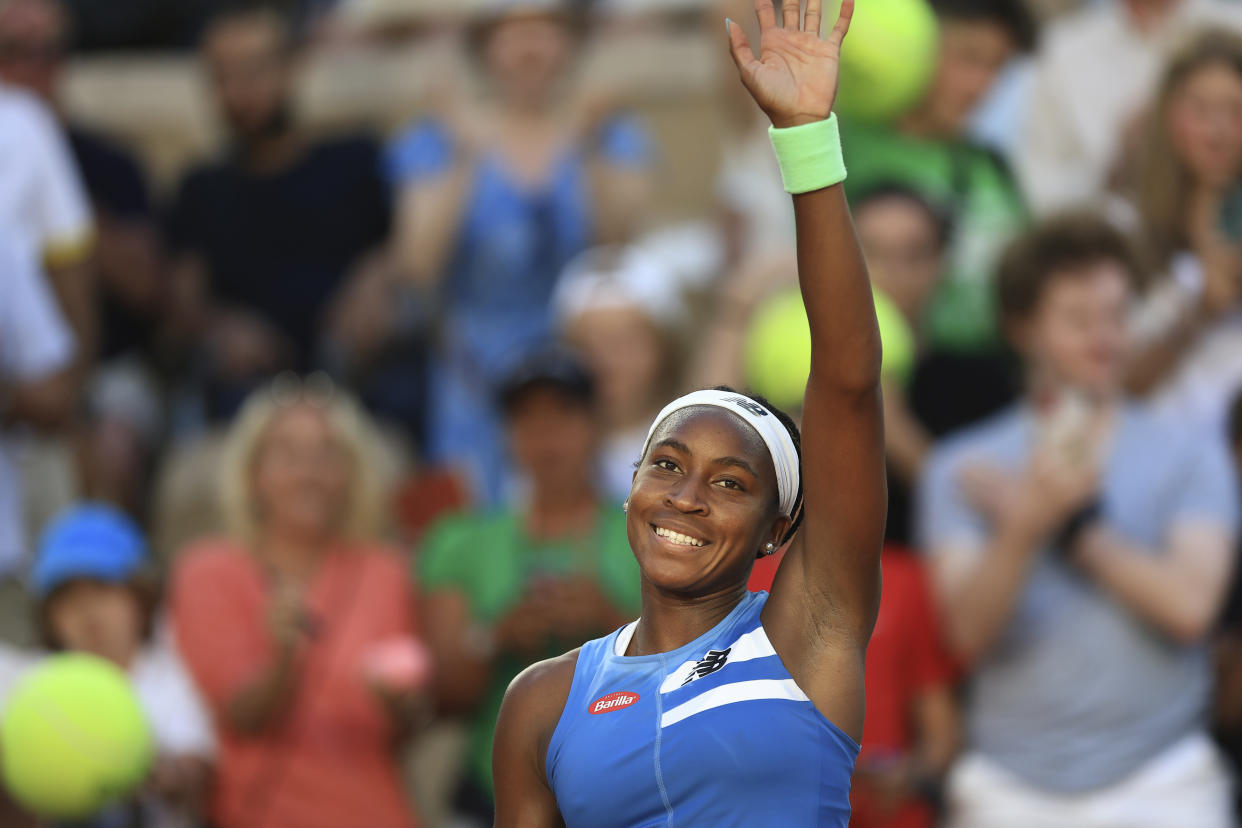 Coco Gauff waved to the crowd after beating Austria's Julia Grabher in their second-round match Thursday at the French Open. (AP Photo/Aurelien Morissard)