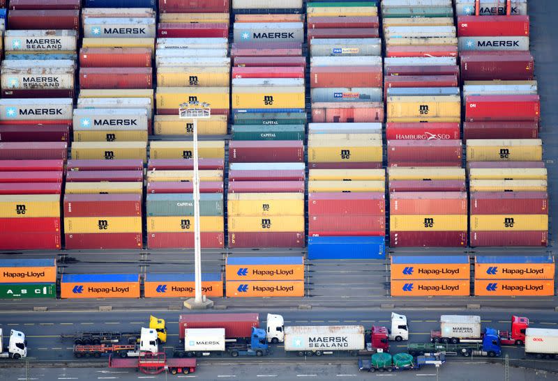 FILE PHOTO: Containers of Maersk, MSC and Hapag-Lloyd are seen at a terminal in the port of Hamburg