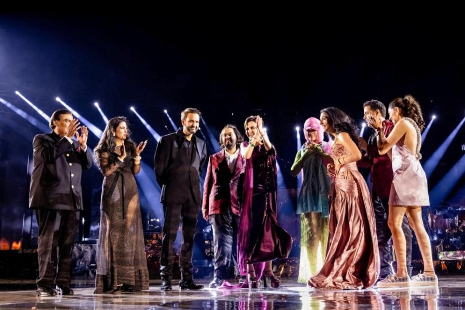 The Ambani family joined Rihanna up on stage before she performed for the crowd. via REUTERS