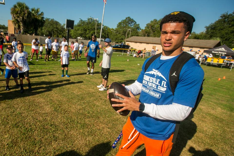 Florida Gator receiver Eugene Wilson III woks on a drill during Legends Football youth football camp by Grady Sports agency in conjunction with legends football non-profit at Citizens Field in Gainesville, FL on Saturday, July 29, 2023. Gator football players and coaches gave players from 5 to 16 a workout on the field. [Alan Youngblood/Gainesville Sun]