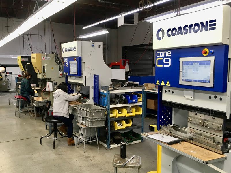 Operators use servo brake presses to form laser-cut steel blanks at Scandic Springs' factory in San Leandro