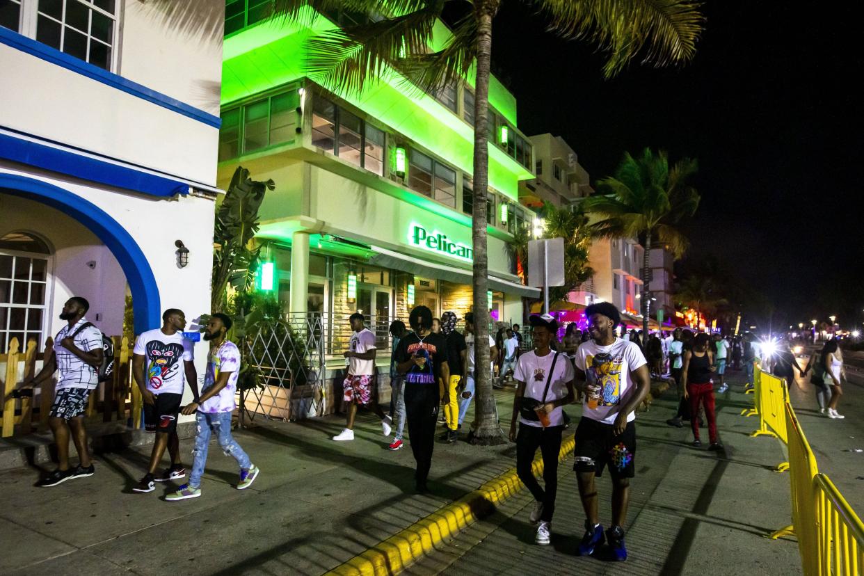 Crowds fill the sidewalks along Ocean Drive during Spring Break in Miami Beach on March 20, 2022.