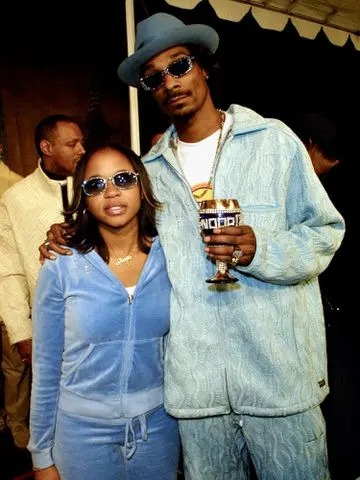 <p>Frederick M. Brown/Getty</p> Shante Broadus and Snoop Dogg in Los Angeles in November 2001