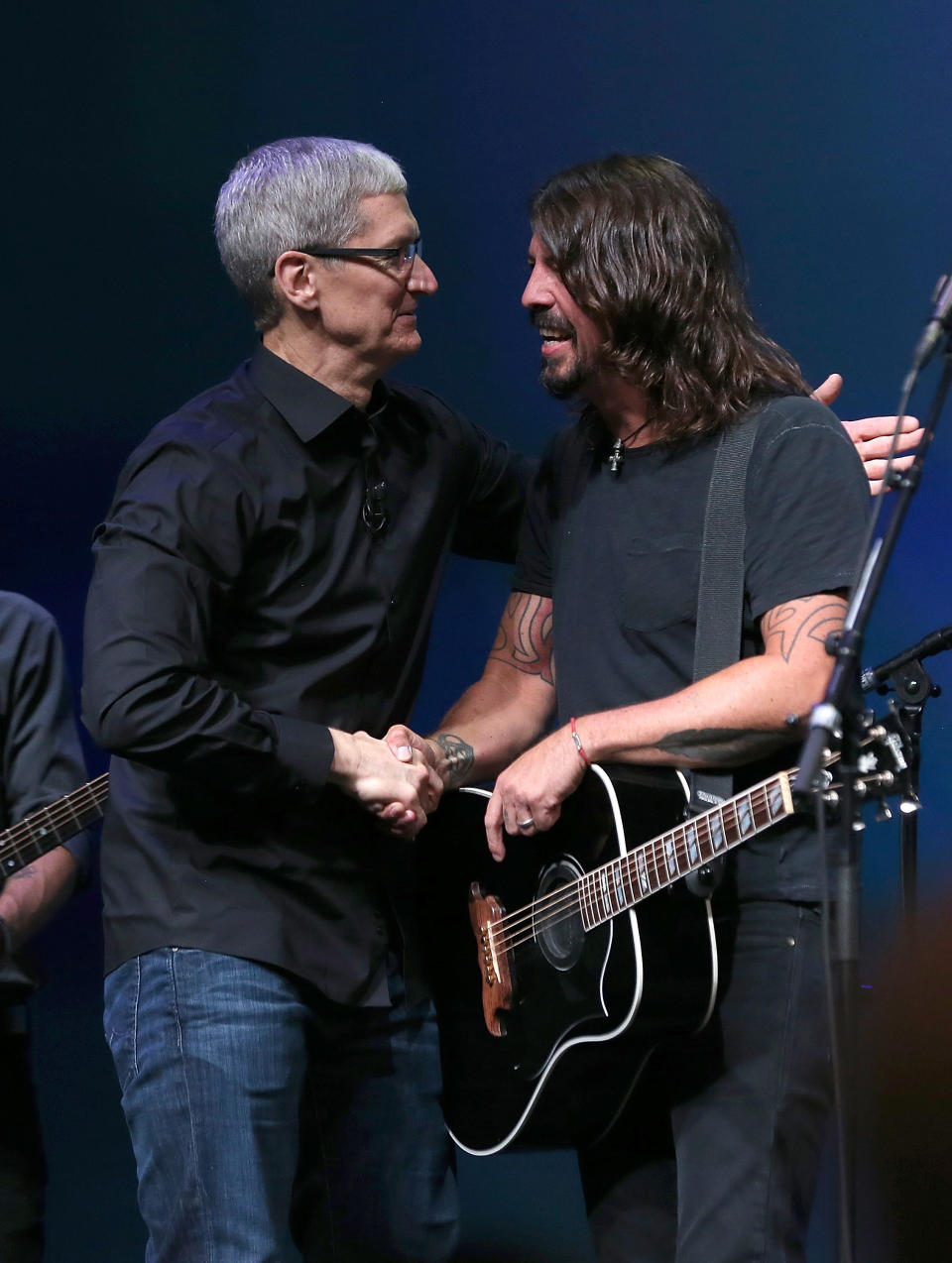 SAN FRANCISCO, CA - SEPTEMBER 12: Apple CEO Tim Cook greets Dave Grohl of the Foo Fighters during an Apple special event at the Yerba Buena Center for the Arts on September 12, 2012 in San Francisco, California. Apple announced the iPhone 5, the latest version of the popular smart phone. (Photo by Justin Sullivan/Getty Images)