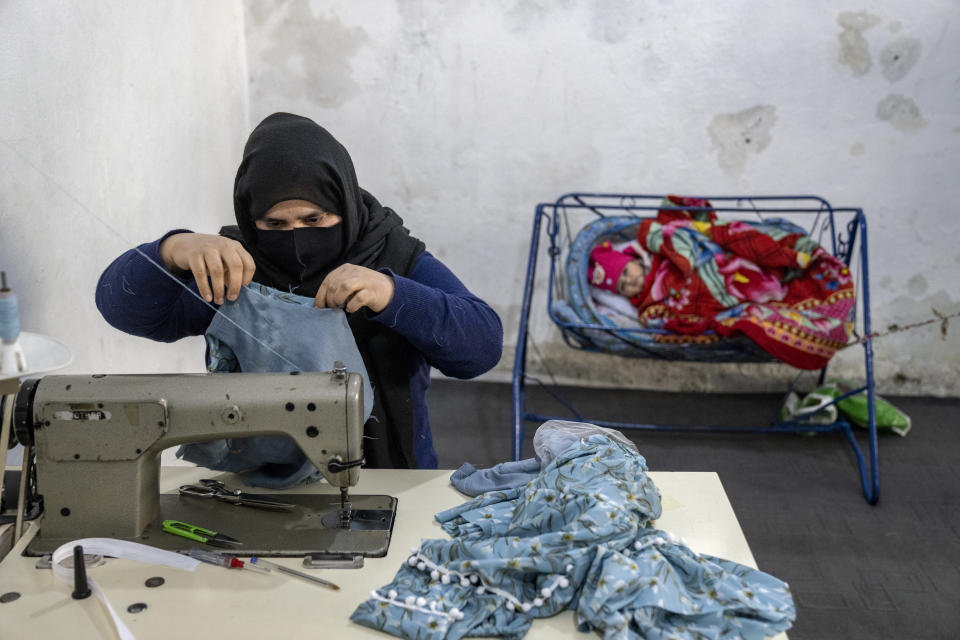 An Afghan woman works in a sewing workshop in Kabul, Afghanistan, Monday, March 6, 2023. After the Taliban came to power in Afghanistan, women have been deprived of many of their basic rights. (AP Photo/Ebrahim Noroozi)