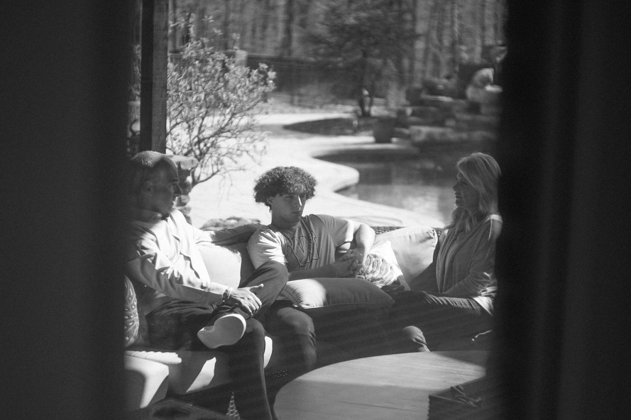 Mason's step-father Dave DeSerio, step-brother Anthony and mother Jennie sitting at home (Micah McCoy for NBC News)