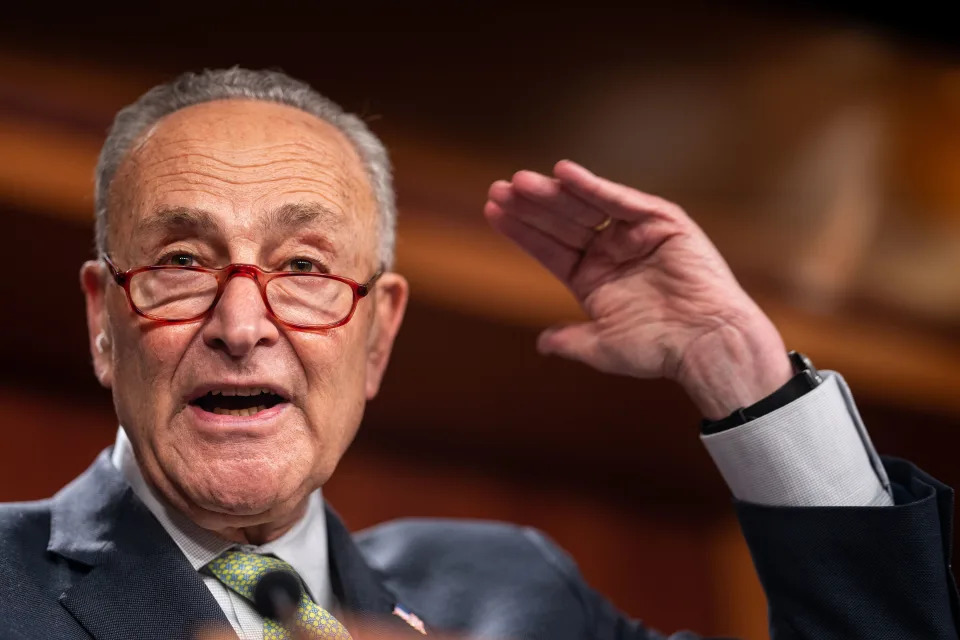 Sen. Chuck Schumer emphasizes a point as he speaks to reporters.