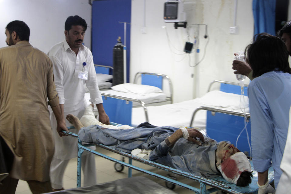 An injured victim of a bomb blast is treated at a hospital, in Saidu Sharif, main town of Pakistan's Swat Valley, Monday, April 24, 2023. Two explosions Monday at a counterterrorism police facility in northwest Pakistan killed few people and wounded dozens, police said. (AP Photo/Naveed Ali)