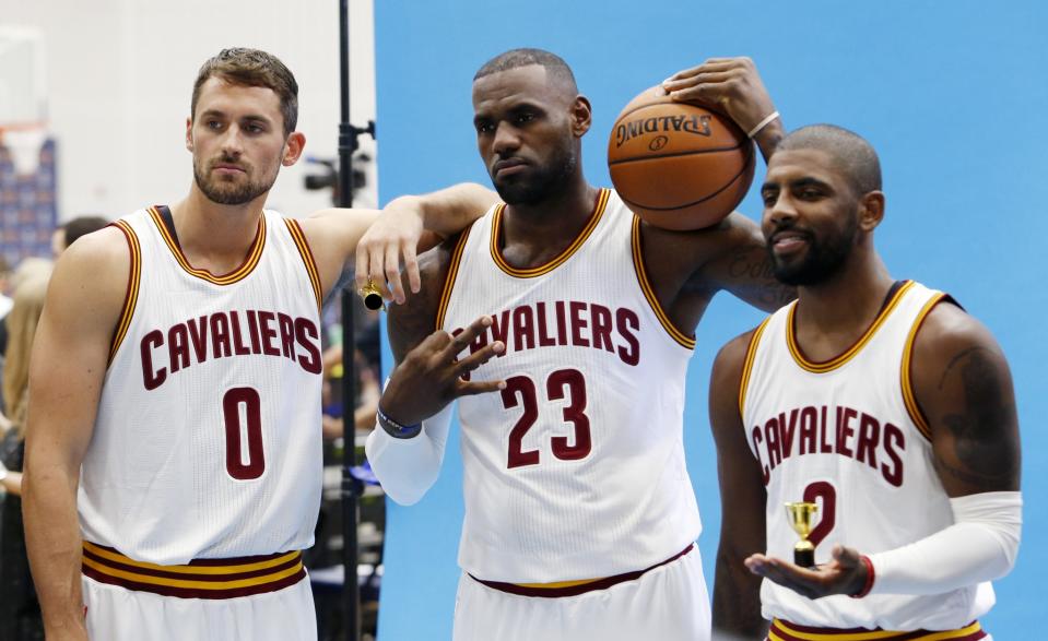 Kevin Love (left), LeBron James (center) and Kyrie Irving will get the night off on Monday. (AP)