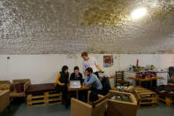 Edina Pottyondy, Andras Fekete-Gyor, Miklos Hajnal and Anna Orosz, leading members of political movement Momentum which challenges Budapest's 2024 Olympic bid with a referendum, hold a discussion at Momentum's headquarters, located in a basement in Budapest, Hungary, February 20, 2017. REUTERS/Laszlo Balogh