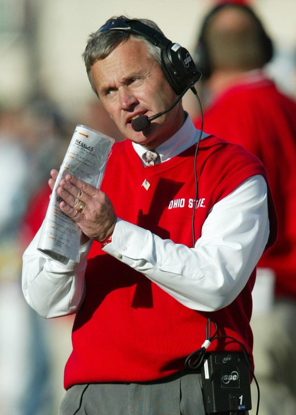 ** FILE ** Ohio State coach Jim Tressel walks the sidelines during his team's 32-19 win over Michigan State, in this Nov. 6, 2004 photo, in East Lansing, Mich. Tressel will be paid almost $2.4 million this season as part of a new seven-year contract. Tressel has yet to sign the contract, Ohio State spokesman Steve Snapp said Thursday. Snapp said the sixth-year coach and Ohio State officials have agreed in principal to the deal. (AP Photo/Al Goldis)