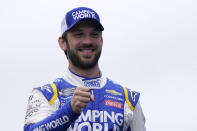 FILE - Daniel Suarez gestures at a NASCAR Cup Series auto race, Sunday, July 18, 2021, in Loudon, N.H. NASCAR's top drivers have once again unified to form an independent council to gain a collective voice in decisions that affect the sport. The Drivers Advisory Council announced Friday, Feb. 11, 2022, is a more organized effort than a previous attempt to unify in 2014. Suarez, the only graduate of NASCAR's diversity program on the board, said there have been positive gains since he arrived from Mexico a decade ago but he'd like to see more accomplished. (AP Photo/Charles Krupa, File)