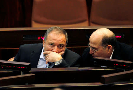 Israel's former Foreign Minister Avigdor Lieberman (L) sits next to former Vice Prime Minister Moshe Yaalon during a memorial service for the late Israeli Tourism Minister Rehavam Zeevi at the Knesset, the Israeli parliament, in Jerusalem November 2, 2011. REUTERS/Baz Ratner/File Photo