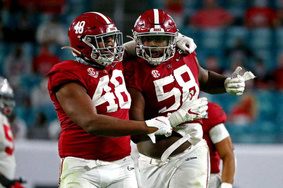 Alabama defensive lineman Christian Barmore (58) celebrated after a play against Ohio State in the national championship game.