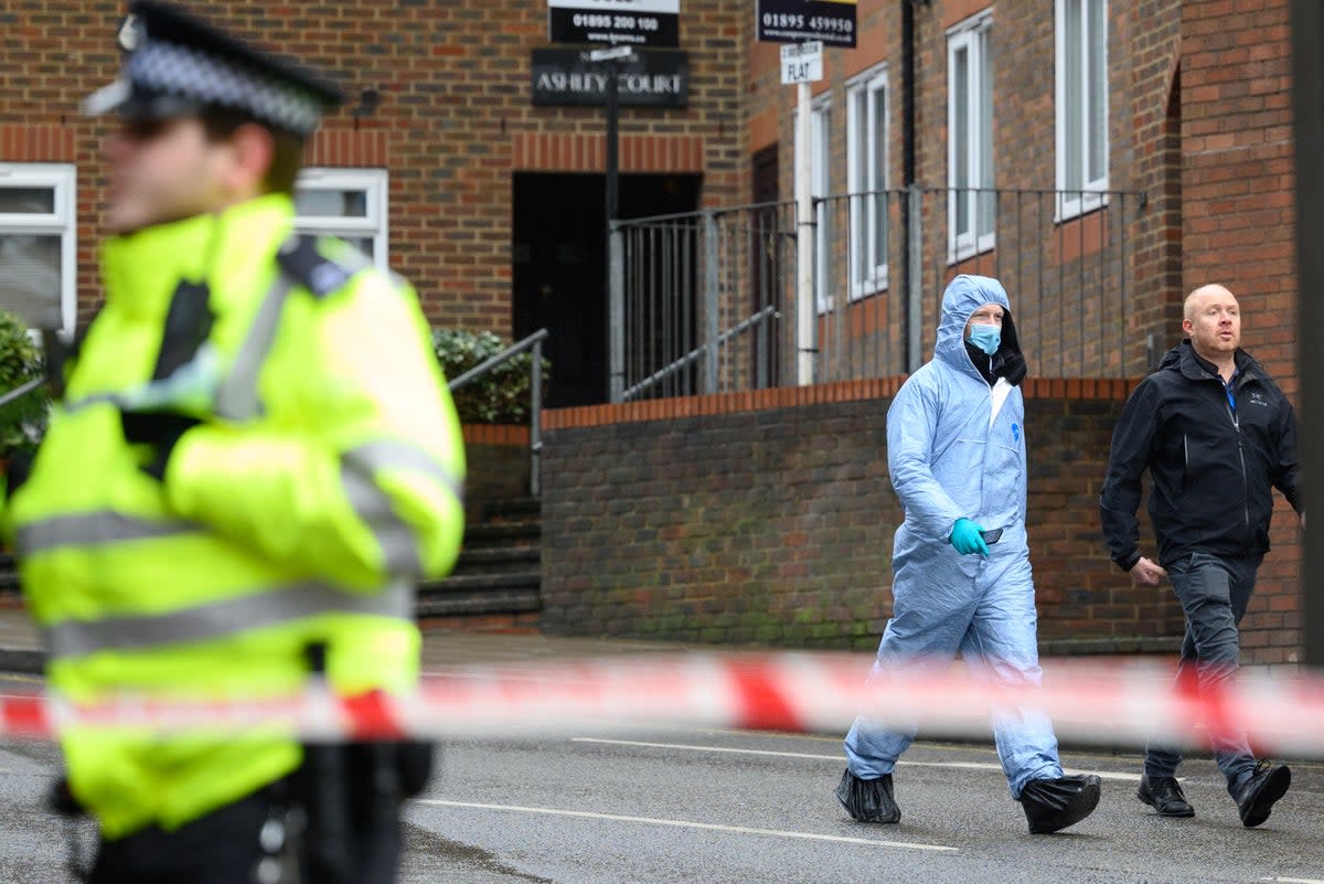 Police and forensic officers at a crime scene (Getty Images)