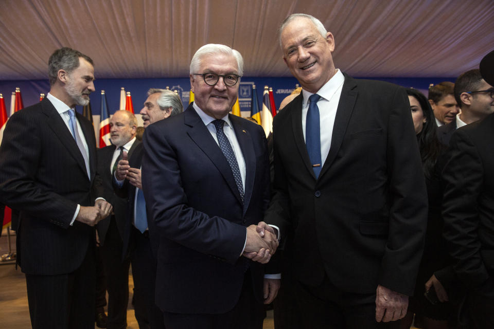 German President Frank-Walter Steinmeier shakes hands with Blue and White Leader Benny Gantz during a dinner reception in Jerusalem on Wednesday, Jan. 22, 2020. Dozens of world leaders have descended upon Jerusalem for the largest-ever gathering focused on commemorating the Holocaust and combating modern-day anti-Semitism. (Heidi Levine/Pool photo via AP)