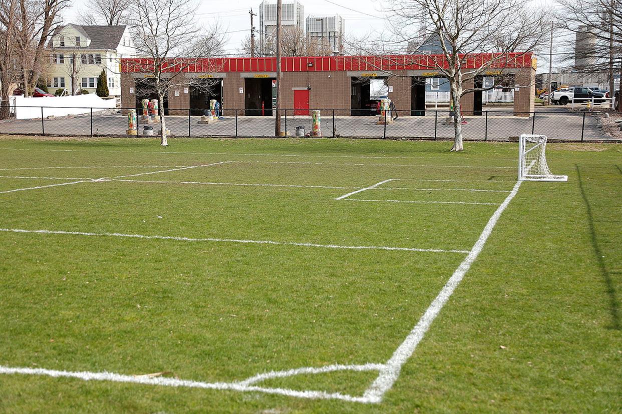 Soccer fields on Cleverly Court in the Quincy Point neighborhood. The city is planning to expand the recreation area by purchasing the car wash next door. Wednesday April 10, 2024