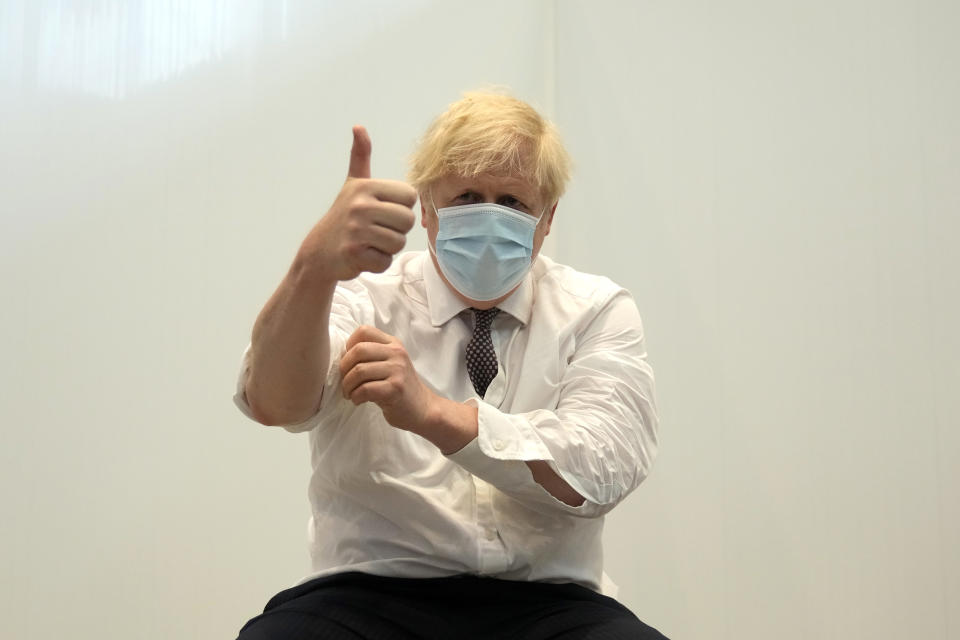 LONDON, ENGLAND - JUNE 03:  British Prime Minister Boris Johnson gives a thumbs up after receiving his second dose of the AstraZeneca coronavirus vaccine from James Black, at the Francis Crick Institute on June 03, 2021 in London, England. More than half of all adults in the United Kingdom have received their second dose of a coronavirus vaccine. (Photo by Matt Dunham - WPA Pool/Getty Images)