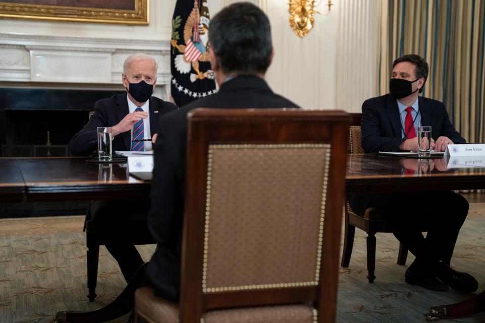 White House chief of staff Ron Klain, right, and Health and Human Services Secretary Xavier Becerra listen as President Joe Biden speaks about the southern border during a meeting in the State Dining Room of the White House, March 24, 2021, in Washington.