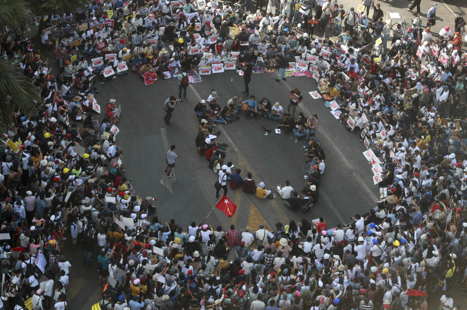 Demonstrators gather in an intersection to protest against the military coup in Yangon, Myanmar Wednesday, Feb. 17, 2021. The U.N. expert on human rights in Myanmar warned of the prospect for major violence as demonstrators gather again Wednesday to protest the military's seizure of power. (AP Photo)