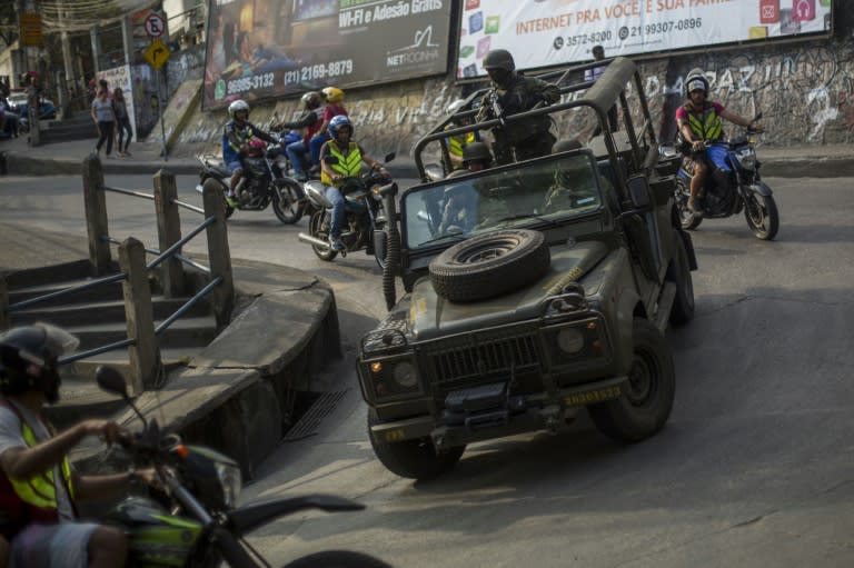 Brazilian soldiers patrol the streets of the Rocinha favela in Rio de Janeiro