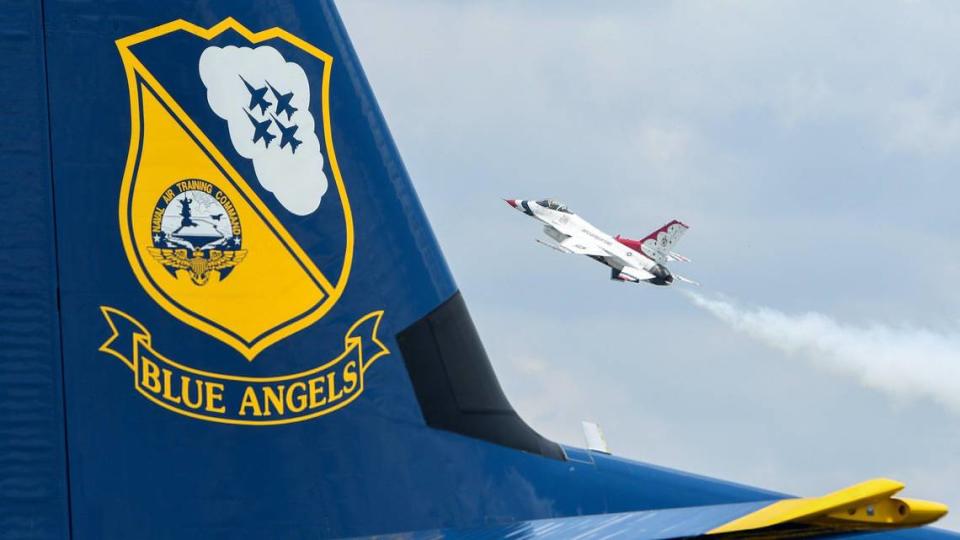 The United States Air Force Thunderbirds plane passed near the Blue Angels support C-130 plane on the second and final day of the 2021 Kansas City Airshow at the New Century AirCenter in New Century, Kansas, July 4, 2021. This year, the Thunderbirds and the Blue Angels performed at the same show, which is rare.
