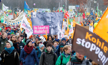 Environmental activists march during an anti-coal protest on the occasion of the Katowice Climate Change Conference in Berlin, Germany December 1, 2018. REUTERS/Fabrizio Bensch