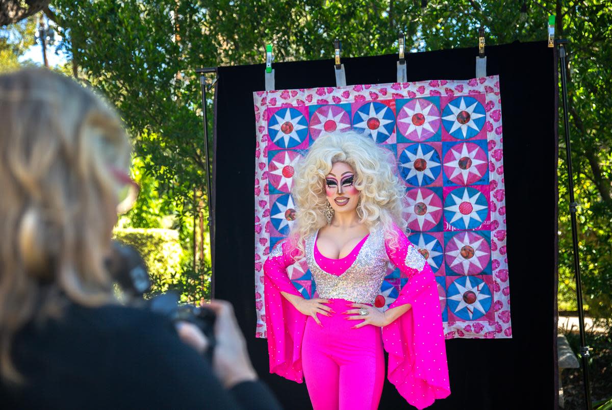 Photographer Sarah Bork takes a picture of Brigitte Bandit during a local literacy event, in Austin, on Nov. 13, 2022.