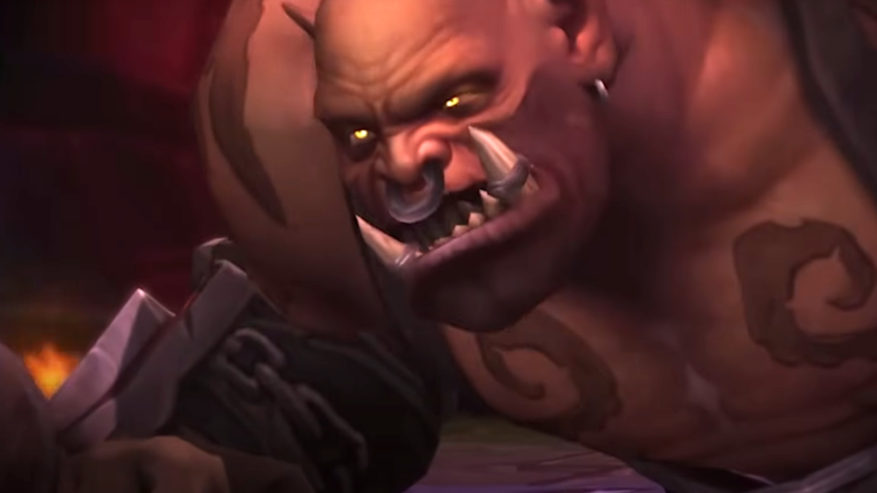  Garrosh Hellscream looks angrily up at Thrall, who is about to whack him with a hammer, in World of Warcraft: Mists of Pandaria. 