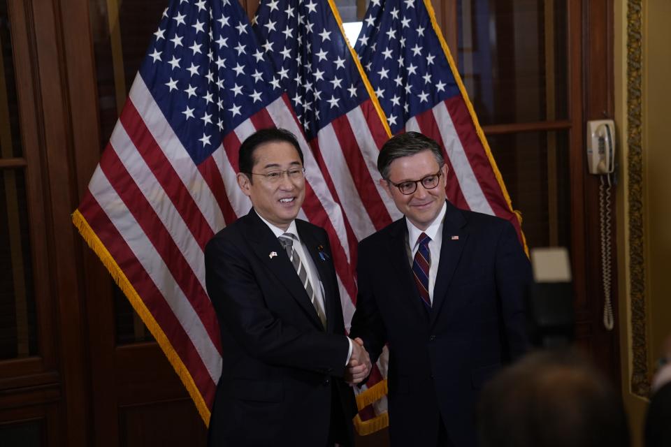 House speaker Mike Johnson, right, greets Japanese Prime Minister Fumio Kishida on April 11, 2024. Kishida will address Congress in Washington, D.C., on Thursday.