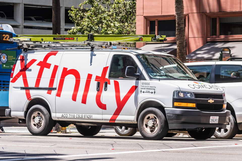 May 20, 2020 San Jose / CA / USA - Side view of Comcast Cable / Xfinity service van driving on the street. Comcast is the largest home internet service provider in the United States.