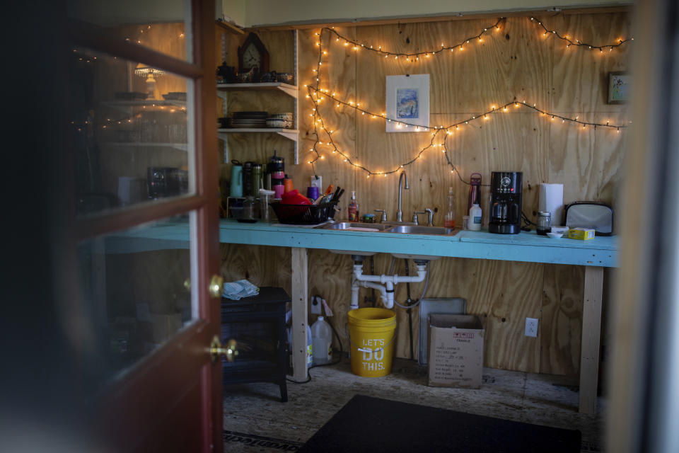 A view of the kitchen in the house of Lisa Edson Neveu that has been damaged by 2023 flood in Montpelier, Vt, July 3, 2024. A year after catastrophic flooding inundated parts of Vermont, some homeowners are still in the throes of recovery. (AP Photo/ Dmitry Belyakov)