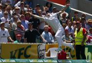 England's Ben Stokes jumps for an unsuccessful catch hit by Australia's Brad Haddin during the second day's play in the second Ashes cricket test at the Adelaide Oval December 6, 2013.