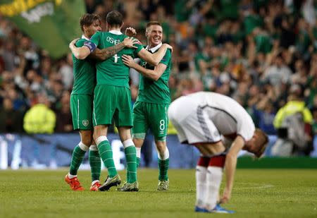 Football - Republic of Ireland v Germany - UEFA Euro 2016 Qualifying Group D - Aviva Stadium, Dublin, Republic of Ireland - 8/10/15 Republic of Ireland's Jeff Hendrick, John O'Shea and James McCarthy celebrate at the end of the match Reuters / Phil Noble