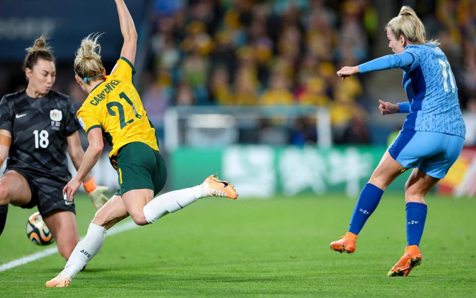 Lauren Hemp of England scores her team's second goal