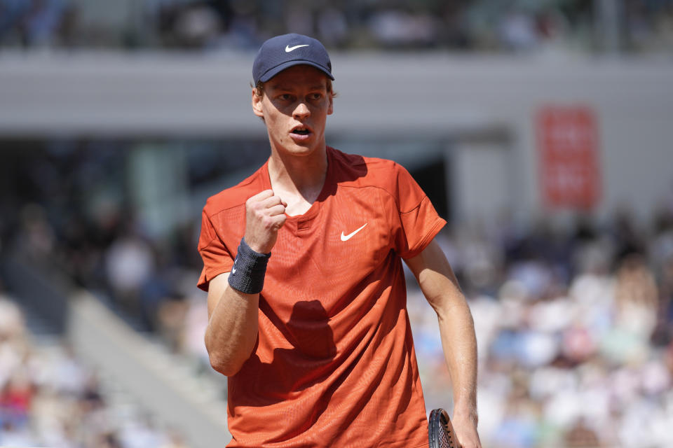 Italy's Jannik Sinner clenches his fist after scoring a point against Bulgaria's Grigor Dimitrov during their quarterfinal match of the French Open tennis tournament at the Roland Garros stadium in Paris, Tuesday, June 4, 2024. (AP Photo/Christophe Ena)