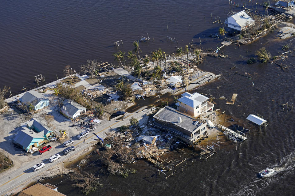 The bridge leading from Fort Myers to Pine Island, Fla., is seen heavily damaged in the aftermath of Hurricane Ian on Pine Island, Fla., Saturday, Oct. 1, 2022. Due to the damage, the island can only be reached by boat or air. (AP Photo/Gerald Herbert)