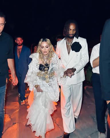 <p>Ricardo Gomes</p> Madonna walking with Akeem Morris in Italy