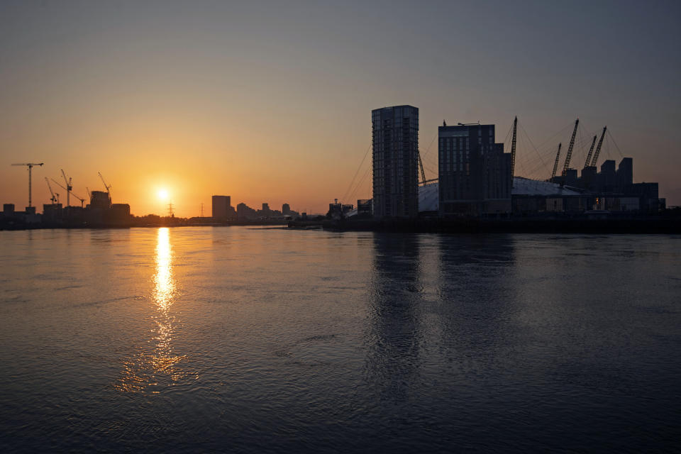 The sun rises over the River Thames in east London, as the UK continues in lockdown to help curb the spread of the coronavirus.