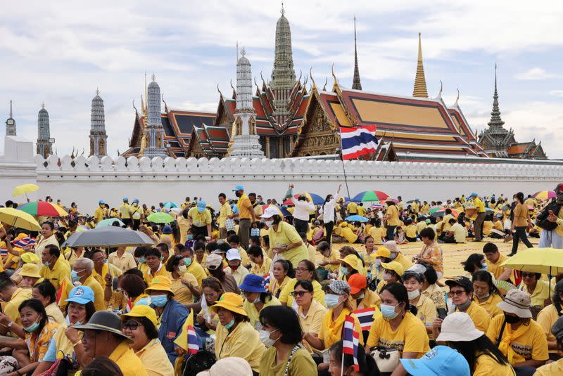 Supporters of Thailand's King Maha Vajiralongkorn and Queen Suthida gather at The Grand Palace in Bangkok